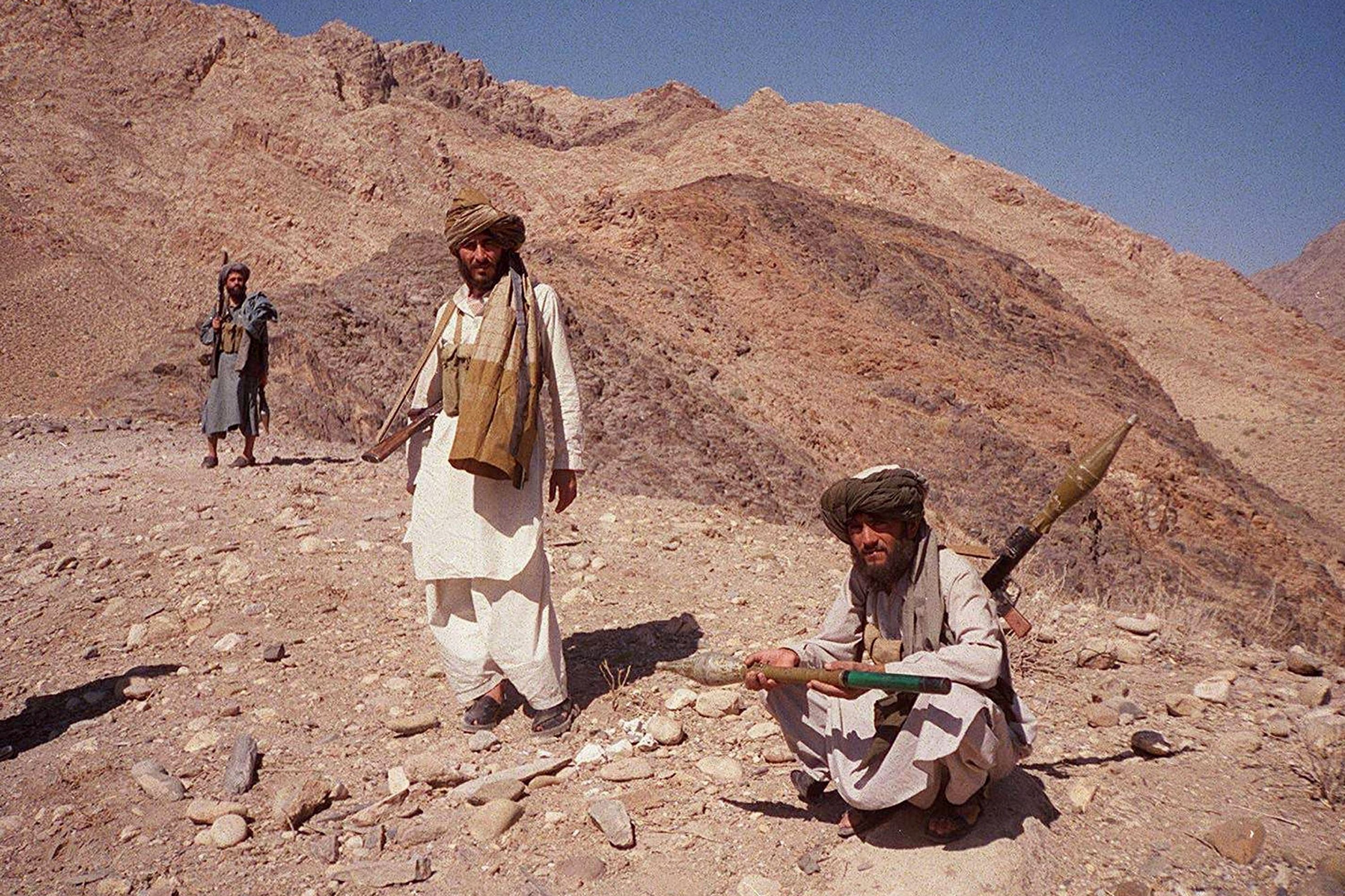 Taliban fighters posing on a hilltop near Jalalabad, Afghanistan on Oct. 14, 2001.