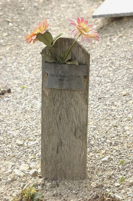 The wooden marker placed over Orhan Efendi&rsquo;s grave when he was buried, and finally the common pit into which his bones were thrown