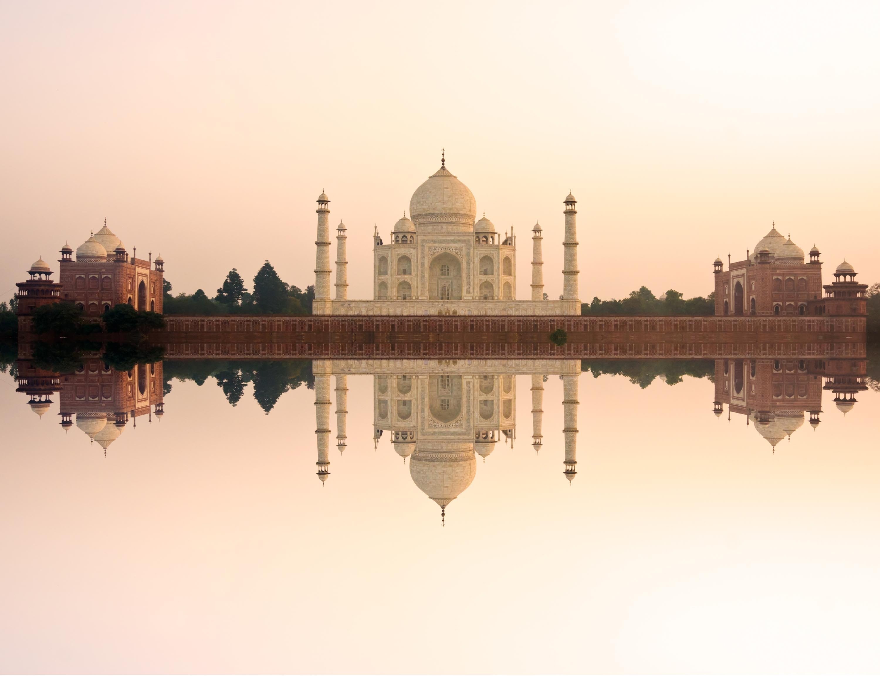 Panoramic view of Taj Mahal at sunset with reflection, Agra, India. 